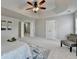Bright bedroom featuring a tray ceiling, carpet, neutral color palette, and decor at 4885 Maristone Landing Way, Cumming, GA 30040