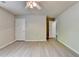 This bedroom features neutral walls, modern flooring, and ample space at 4885 Maristone Landing Way, Cumming, GA 30040
