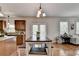 A view from the kitchen showing the hardwood floors and an adjacent dining area at 4885 Maristone Landing Way, Cumming, GA 30040