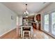 Dining area and kitchen layout showcasing natural light and open-concept design at 4885 Maristone Landing Way, Cumming, GA 30040