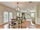 Bright dining area featuring a wooden table set and french doors at 4885 Maristone Landing Way, Cumming, GA 30040