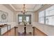 Inviting dining room with a rustic table, hardwood floors, and decorative chandelier at 4885 Maristone Landing Way, Cumming, GA 30040