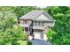 Charming two-story home featuring a brick facade, covered porch, and a well-manicured front yard at 4885 Maristone Landing Way, Cumming, GA 30040