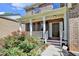Charming brick home with a covered front porch and beautiful landscaping at 4885 Maristone Landing Way, Cumming, GA 30040