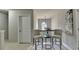 Hallway with natural light, neutral paint, chair-rail, carpet, and decorative artwork at 4885 Maristone Landing Way, Cumming, GA 30040
