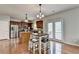 An open kitchen and dining area combo with stainless steel appliances and access to a patio at 4885 Maristone Landing Way, Cumming, GA 30040
