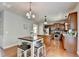 Open kitchen concept with stainless steel appliances and view of dining area at 4885 Maristone Landing Way, Cumming, GA 30040