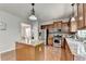 Well-lit kitchen with stainless steel appliances and a central island at 4885 Maristone Landing Way, Cumming, GA 30040