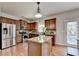 Modern kitchen with stainless steel appliances and an island counter at 4885 Maristone Landing Way, Cumming, GA 30040
