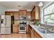 Spacious kitchen featuring stainless steel appliances and granite countertops at 4885 Maristone Landing Way, Cumming, GA 30040