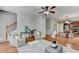 Comfortable living room showing open floor plan and view of the updated kitchen at 4885 Maristone Landing Way, Cumming, GA 30040