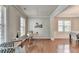 Spacious living room with hardwood floors, wainscoting, and large windows at 4885 Maristone Landing Way, Cumming, GA 30040