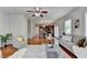 Bright living room with open layout connecting to the modern kitchen area and hardwood floors at 4885 Maristone Landing Way, Cumming, GA 30040