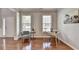 Bright living room featuring hardwood floors, a chair, and natural light at 4885 Maristone Landing Way, Cumming, GA 30040
