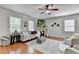 Spacious living room featuring large windows, comfortable seating, and stylish decor at 4885 Maristone Landing Way, Cumming, GA 30040