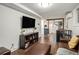 Cozy basement with dark brown accents featuring a large screen TV and small kitchen area at 677 Holmes Nw St, Atlanta, GA 30318