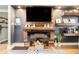 Close up of a modern fireplace with wooden mantle and built-in shelving at 677 Holmes Nw St, Atlanta, GA 30318