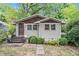 Charming home with a well-maintained lawn and inviting front entrance at 677 Holmes Nw St, Atlanta, GA 30318