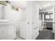 Laundry area and adjacent bathroom featuring washer, dryer, and tiled walk-in shower at 677 Holmes Nw St, Atlanta, GA 30318