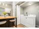 Convenient laundry area with modern washer and dryer near kitchen at 677 Holmes Nw St, Atlanta, GA 30318