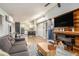 Open-concept living space with modern fireplace and easy access to the kitchen at 677 Holmes Nw St, Atlanta, GA 30318