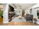 Bright living room featuring a sleek fireplace, modern furnishings, and hardwood floors at 677 Holmes Nw St, Atlanta, GA 30318