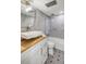 Beautiful bathroom featuring modern vanity, decorative tiled floor, tub, and tiled shower at 157 Maribeau Nw Sq, Atlanta, GA 30327