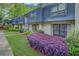 Attractive exterior of this townhome featuring a well-manicured lawn and lush landscaping at 157 Maribeau Nw Sq, Atlanta, GA 30327