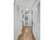 Hallway with a laundry area leading to a bathroom at 157 Maribeau Nw Sq, Atlanta, GA 30327