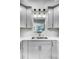 Well-designed kitchen sink and window with modern fixtures and lighting at 157 Maribeau Nw Sq, Atlanta, GA 30327