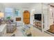 Cozy living room with a patterned chair, coffee table, and lots of natural light at 157 Maribeau Nw Sq, Atlanta, GA 30327