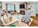 Bright living room featuring a cozy fireplace and comfortable seating area at 157 Maribeau Nw Sq, Atlanta, GA 30327