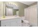Bathroom featuring modern vanity, light fixtures, and shower-tub combination at 2105 Country Park Se Dr, Smyrna, GA 30080