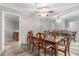 Formal dining room with mirror wall, traditional furniture and elegant ceiling fan at 2105 Country Park Se Dr, Smyrna, GA 30080