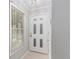 Bright entryway featuring a white front door with decorative window panels at 2105 Country Park Se Dr, Smyrna, GA 30080