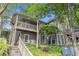 Two-story condo featuring a staircase entry, private balcony, and lush greenery at 2105 Country Park Se Dr, Smyrna, GA 30080