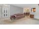 Inviting living room with carpeted floors, and a floral patterned sofa next to front door at 2105 Country Park Se Dr, Smyrna, GA 30080