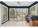 Bright sunroom with multiple large windows offering ample natural light and tile flooring at 2105 Country Park Se Dr, Smyrna, GA 30080