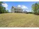 Spacious backyard, with a lush lawn, providing ample space for recreation and relaxation in a serene setting at 2749 Porches Ln, Dacula, GA 30019