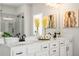 Stylish bathroom features double sinks, quartz countertops, and a frameless glass shower at 2749 Porches Ln, Dacula, GA 30019