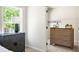 Charming bedroom showcasing stylish dressers and a view into the closet with a bright window at 2749 Porches Ln, Dacula, GA 30019