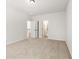 Carpeted bedroom featuring neutral walls, and entryways to bathroom and hallway at 2749 Porches Ln, Dacula, GA 30019