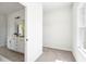 Open closet with a large window showing views to the bathroom featuring a double sink vanity at 2749 Porches Ln, Dacula, GA 30019