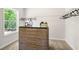 Bright closet featuring a wooden dresser, and well-organized storage space at 2749 Porches Ln, Dacula, GA 30019