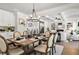 Spacious dining room featuring a modern chandelier, coffered ceilings, and hardwood floors at 2749 Porches Ln, Dacula, GA 30019