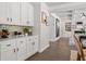 Hallway featuring a butler's pantry, dark hardwood floors, and an open concept design at 2749 Porches Ln, Dacula, GA 30019