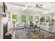 Spacious living room with coffered ceilings, fireplace, large windows, and elegant decor at 2749 Porches Ln, Dacula, GA 30019