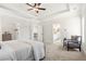 Bright main bedroom with tray ceilings, featuring entrances to ensuite bathroom and closet at 2749 Porches Ln, Dacula, GA 30019