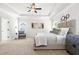 Serene main bedroom with trey ceiling, neutral tones, and a luxurious bed at 2749 Porches Ln, Dacula, GA 30019