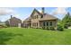 Expansive backyard with lush green lawn, ideal for outdoor activities and relaxation at 390 Scott Farm Dr, Powder Springs, GA 30127